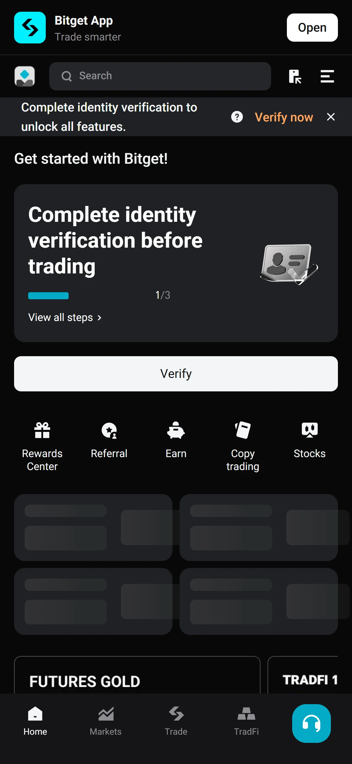 The logged-in Bitget home with a banner prompting identity verification.